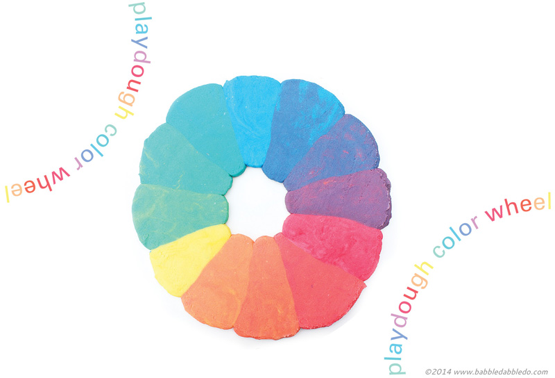 Learn how to make playdough and explore color theory by creating a rainbow play dough color wheel.