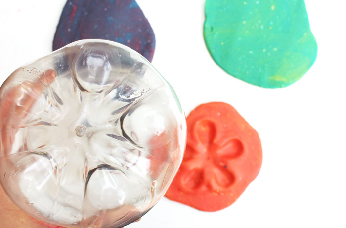Here's a novel idea for play dough activities: use recyclables as play dough toys. Recycled plastics have some amazing textures for kids to explore.