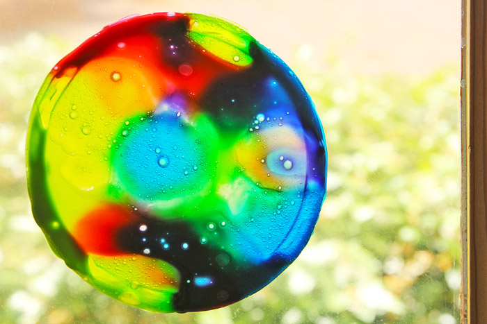 Learn how to make colorful suncatchers from leftover homemade slime.