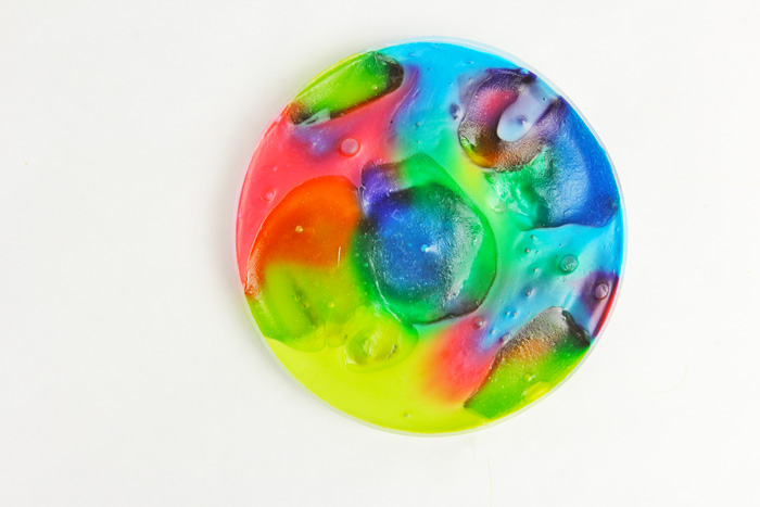 Learn how to make colorful suncatchers from leftover homemade slime.