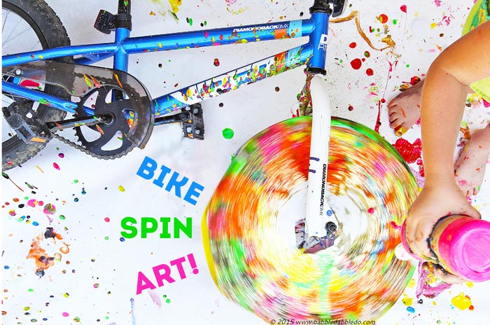 Make Spin Art using a bike tire! Messy and fun process and action art project for kids!