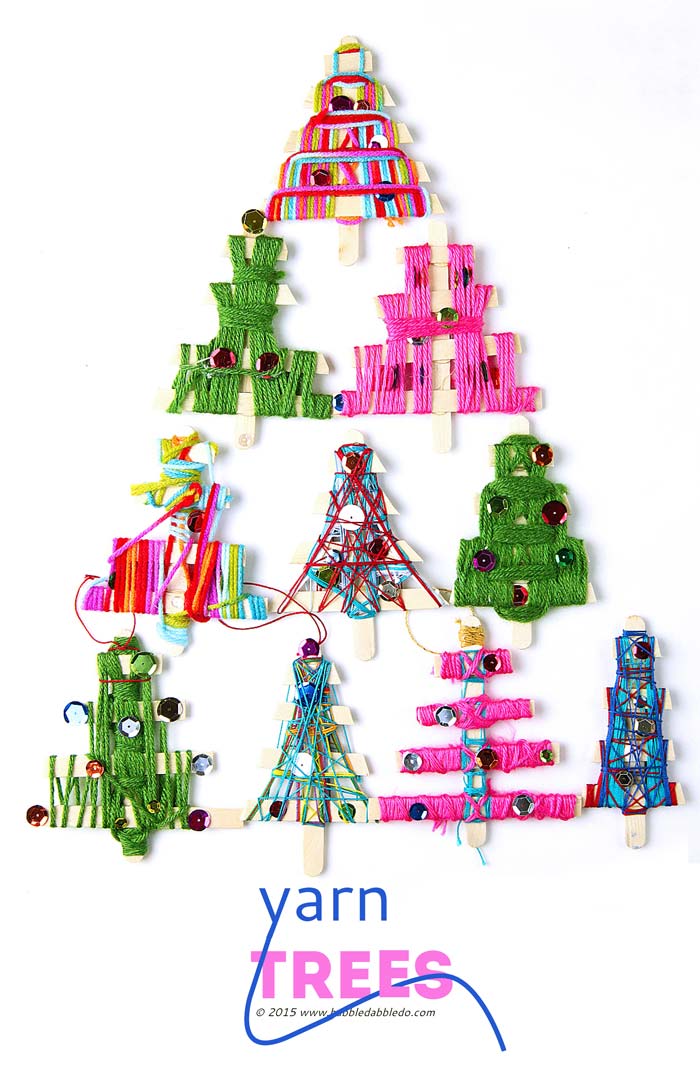 Make homemade Christmas ornaments from craft sticks and string/yarn. Fun holiday weaving project for kids.