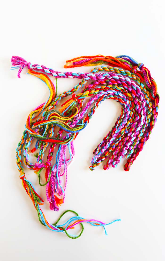 Easy and colorful yarn craft: Learn how to make rope out of a few strands of loose yarn.
