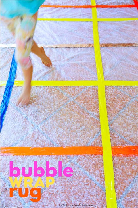 Simple craft idea: Turn leftover bubble wrap into a rug for some sensory fun!