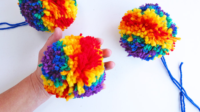 Learn how to make pom poms using two easy methods...psst...one method requires no special tools!