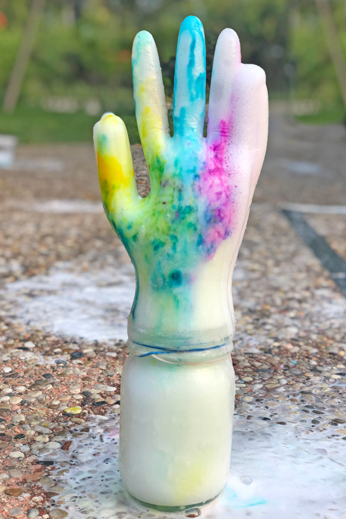 Fizzing Hands is a wonderful acid base reaction example and a hilarious twist on the classic vinegar and baking soda science experiment.