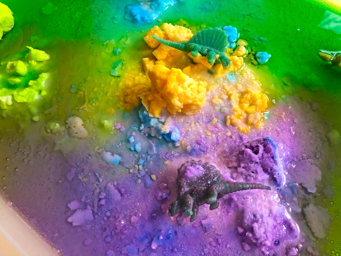 Kids of all ages will love this fizzing dinosaur science activity featuring baking soda! This is an engaging sensory play activity for kids.