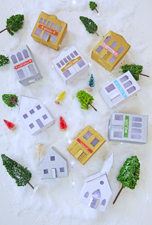 If you love miniatures you will love this DIY paper Christmas Village! Print the templates on glitter cardstock and create a holiday village.
